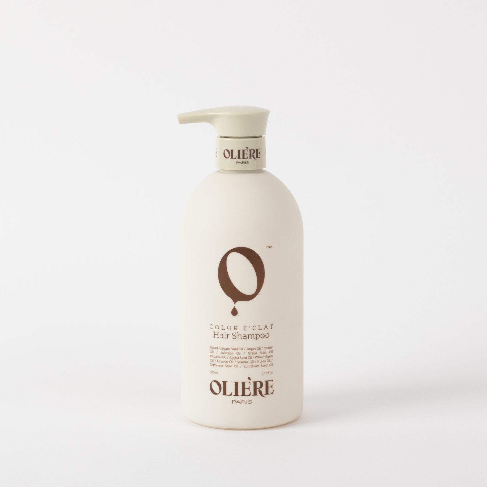 A large bottle of Olière Color & Clât Hair Shampoo in an off-white bottle with a beige pump dispenser, featuring brown lettering on a clean white background.